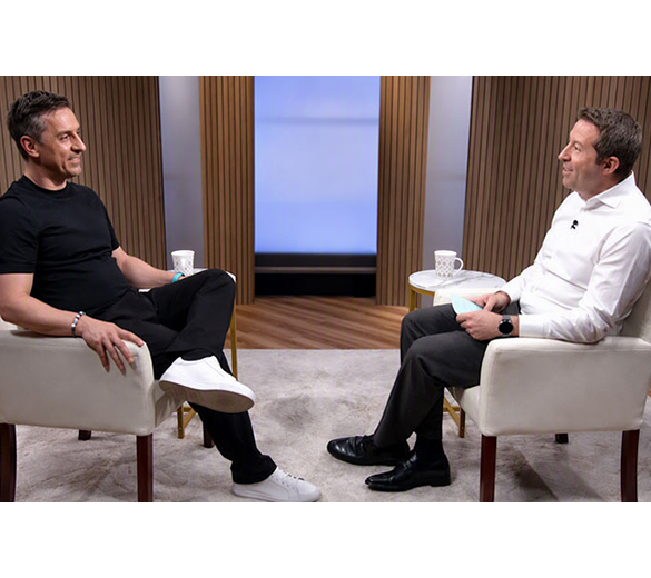 Image of broadcaster and business leader Gary Neville sitting across from Bank of America Global Research’s Martyn Briggs being interviewed.